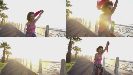 在海边骑自行车的女孩高清在线视频素材下载