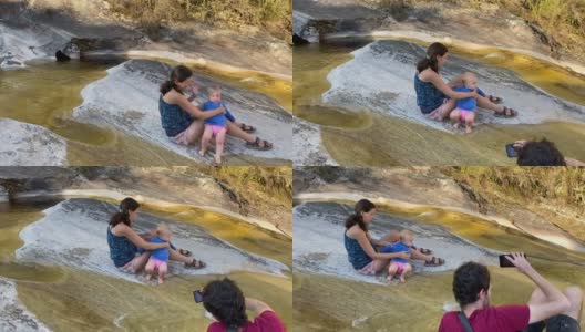 一家人在米纳斯吉拉斯州峡谷享受瀑布区高清在线视频素材下载