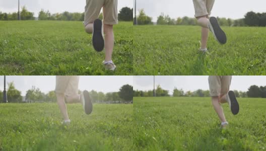 一个男孩的腿在绿色的草地上跑步的慢镜头高清在线视频素材下载
