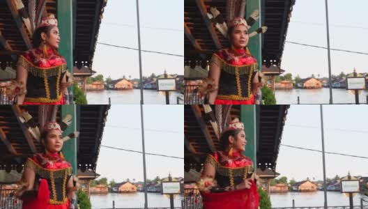 年轻女子Dayak站在河边享受高清在线视频素材下载