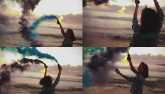 日落时分，年轻女子背着烟雾弹在海滩上奔跑高清在线视频素材下载