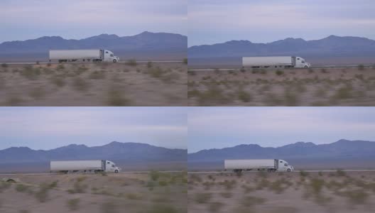 特写:货运半挂车在空旷的公路上行驶和运输货物高清在线视频素材下载