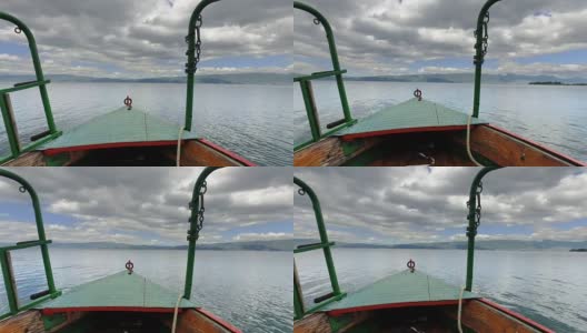 冒险的背景。泰国传统木船在奥赫里德湖平静的水面上移动高清在线视频素材下载