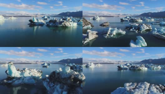 4K空中电影飞越冰川碎片泻湖，冰岛Jokulsarlon高清在线视频素材下载