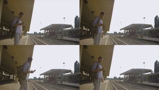 年轻人独自在火车站等待火车高清在线视频素材下载