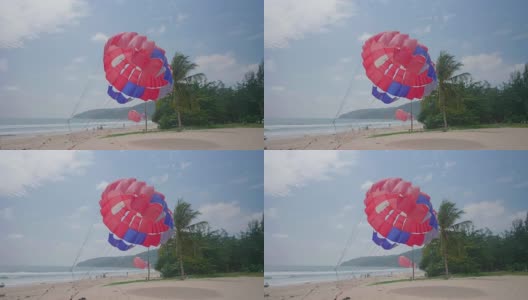 泰国普吉岛卡伦海滩上的彩色降落伞高清在线视频素材下载