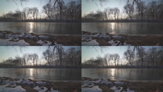 一个宁静的早晨，日出在河岸上，多莉拍摄高清在线视频素材下载