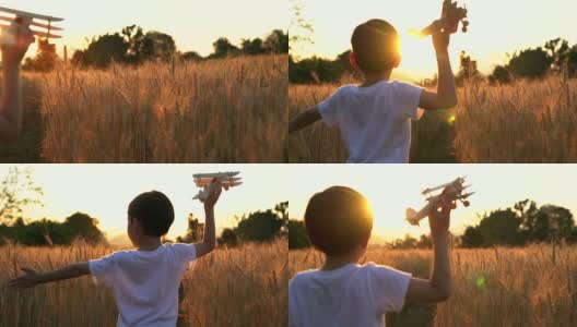可爱的亚洲小孩在日落时分的稻田里玩玩具飞机。高清在线视频素材下载