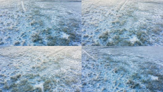 一场雪后的一个霜冻和雾蒙蒙的早晨，未开垦的土地的鸟瞰图高清在线视频素材下载