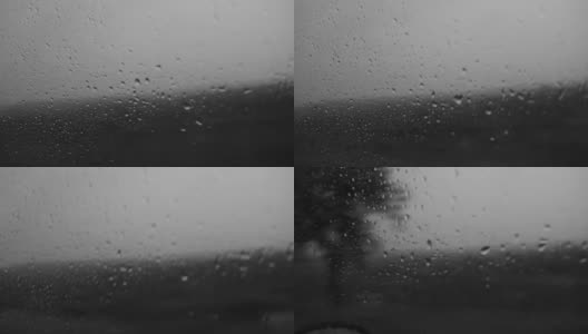 雨天旅行时，雨滴落在车窗上。坏天气的概念。高清在线视频素材下载