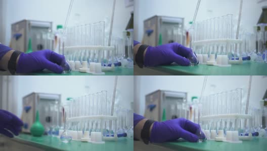 一位化学家正在制药实验室用餐桌上的化学制品进行研究高清在线视频素材下载