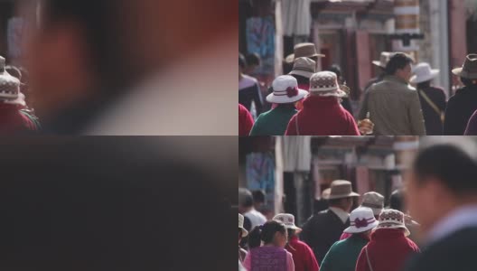 拥挤的人们在西藏祈祷和行走高清在线视频素材下载