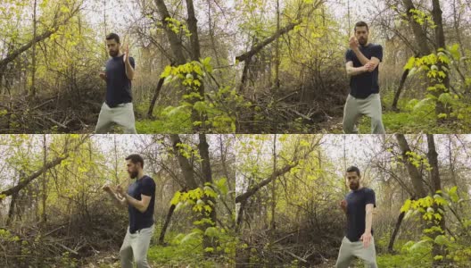 一个年轻人在春天的森林里练习空手道。高清在线视频素材下载