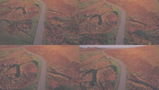 穿过英国德文郡达特穆尔国家公园的公路。空中无人机视图高清在线视频素材下载