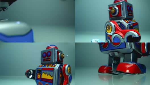 一个古色古香、色彩鲜艳的金属发条机器人在灯光背景上走着高清在线视频素材下载