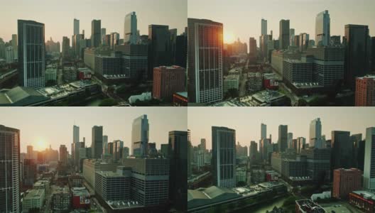 无人机飞过芝加哥河，太阳在市中心建筑后升起高清在线视频素材下载