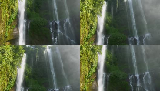 热带迷人的瀑布。水从高处飞起形成水花。印尼巴厘岛高清在线视频素材下载