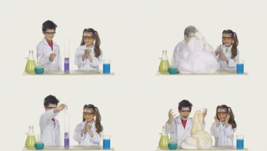 两个可爱的化学家孩子做有趣和成功的实验孤立在白色的背景高清在线视频素材下载