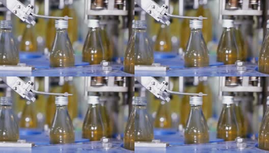 玻璃瓶装水自动生产线。玻璃瓶装药草饮料。饮用水和饮料的生产。高清在线视频素材下载