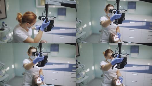 女牙医使用牙科工具-显微镜，镜子和探针在牙科诊所治疗病人的牙齿。医学、牙科和保健概念。牙科设备高清在线视频素材下载