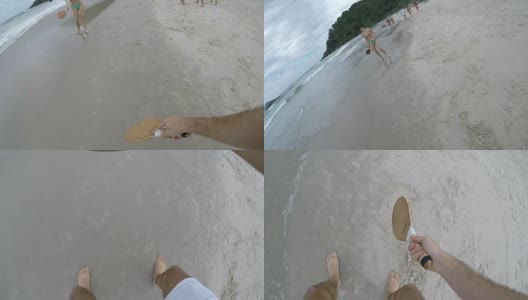 一对情侣在沙滩上玩壁画高清在线视频素材下载