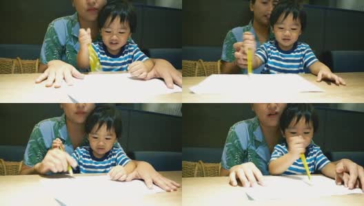亚洲小男孩和妈妈一起画画和玩高清在线视频素材下载