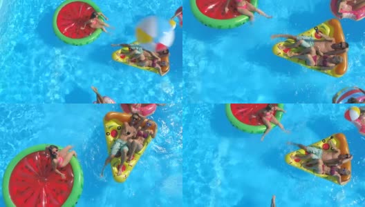天线:好玩的人们在游泳池里的彩色充气浮标上玩耍高清在线视频素材下载
