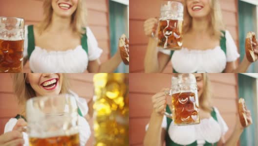 碰杯喝啤酒啤酒节上的一个女孩。特写，巴伐利亚民族服装高清在线视频素材下载