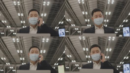 新常态概念的商人谁等待航班和工作在机场-股票视频高清在线视频素材下载