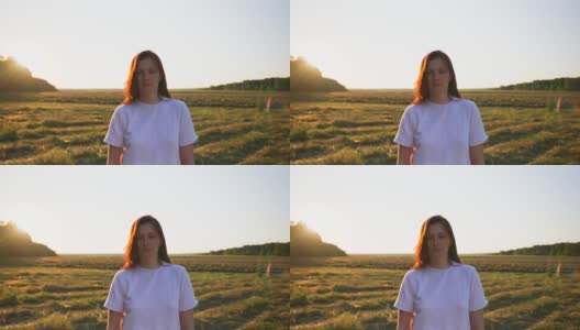 画面中的女性，镜头靠近，背景中的田野，日落高清在线视频素材下载