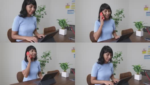 一个亚洲女人在会议室里工作，正在讲电话高清在线视频素材下载