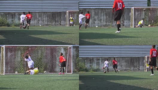 男孩足球运动员在球场上练习慢动作高清在线视频素材下载