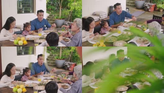 亚洲一家几代人在后院一起吃饭高清在线视频素材下载