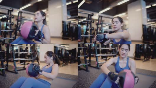 健身女性在健身房锻炼核心肌肉高清在线视频素材下载