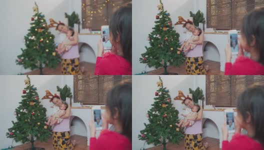 可爱的小女孩在圣诞节期间用手机视频打电话给奶奶高清在线视频素材下载