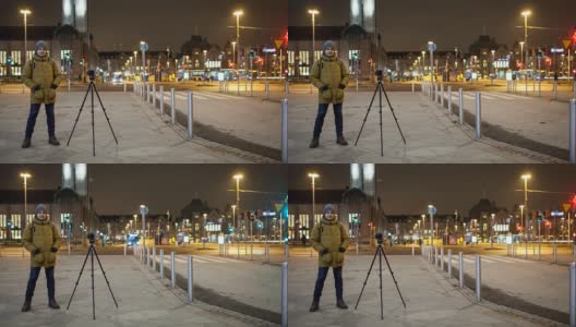 夜街时光流逝，男子拍摄视频。芬兰赫尔辛基高清在线视频素材下载
