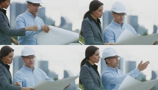 总工程师向商业女性投资者展示项目草稿。在摩天大楼的背景城市。高清在线视频素材下载