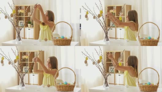 女孩在家用复活节彩蛋装饰柳树高清在线视频素材下载