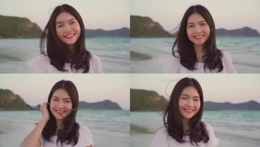 年轻的亚洲女人在海滩上感到快乐，美丽的女性快乐放松微笑在海滩附近的海边当日落在傍晚。生活方式女性旅行海滩概念。高清在线视频素材下载
