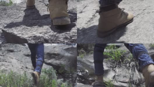男人的脚踩在山上的石头上。男脚在鞋走在岩石山的旅程。旅游、徒步旅行和旅游高清在线视频素材下载