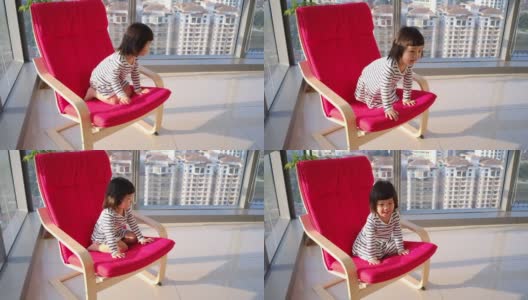 阳台上的一个亚洲女婴高清在线视频素材下载