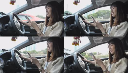 亚洲女商人驾驶一辆装有智能手机的汽车高清在线视频素材下载