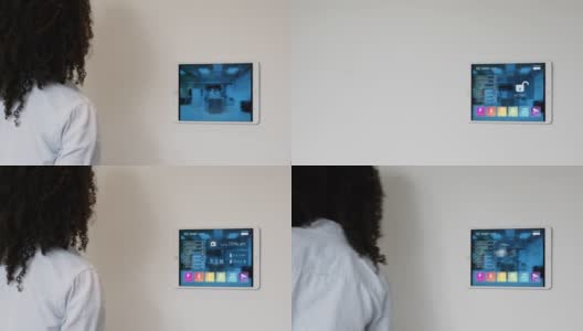 一个女人离开家的慢动作从平板电脑上设置安全系统高清在线视频素材下载