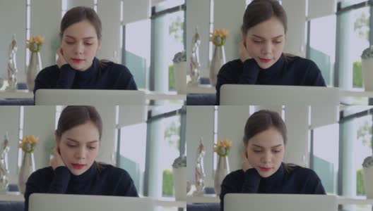 亚洲女性在冠状病毒肆虐期间坐在家里上网工作高清在线视频素材下载