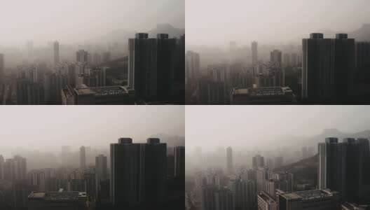 无人机在雾天拍摄的城市建筑高清在线视频素材下载