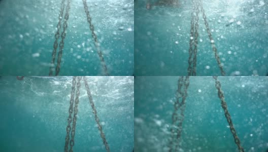 水下绳索，浮标和链系在绿松石海床的底部。系泊系统。泡泡，微粒，浮游生物，动物和植物。版本6高清在线视频素材下载