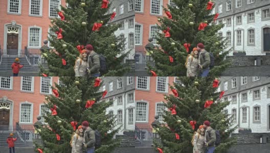 一对情侣站在圣诞树旁高清在线视频素材下载
