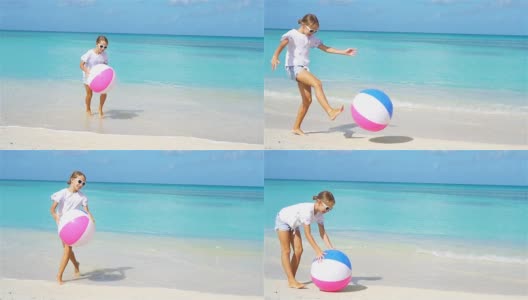 可爱的小女孩在沙滩上玩球高清在线视频素材下载