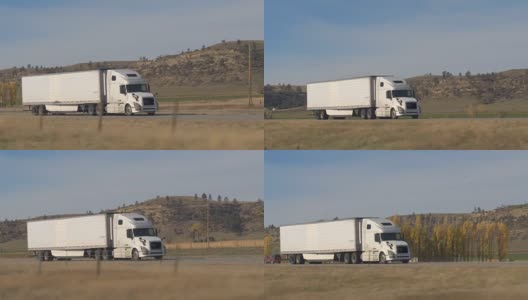 特写:白色半挂车拖着货物穿过美国乡村公路高清在线视频素材下载