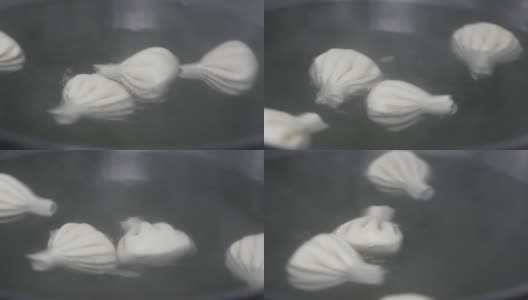 几只生的辛卡利在大锅里一圈一圈的沸腾着靠近。高清在线视频素材下载